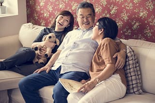 Asian,Family,Having,Fun,In,The,Living,Room,Together